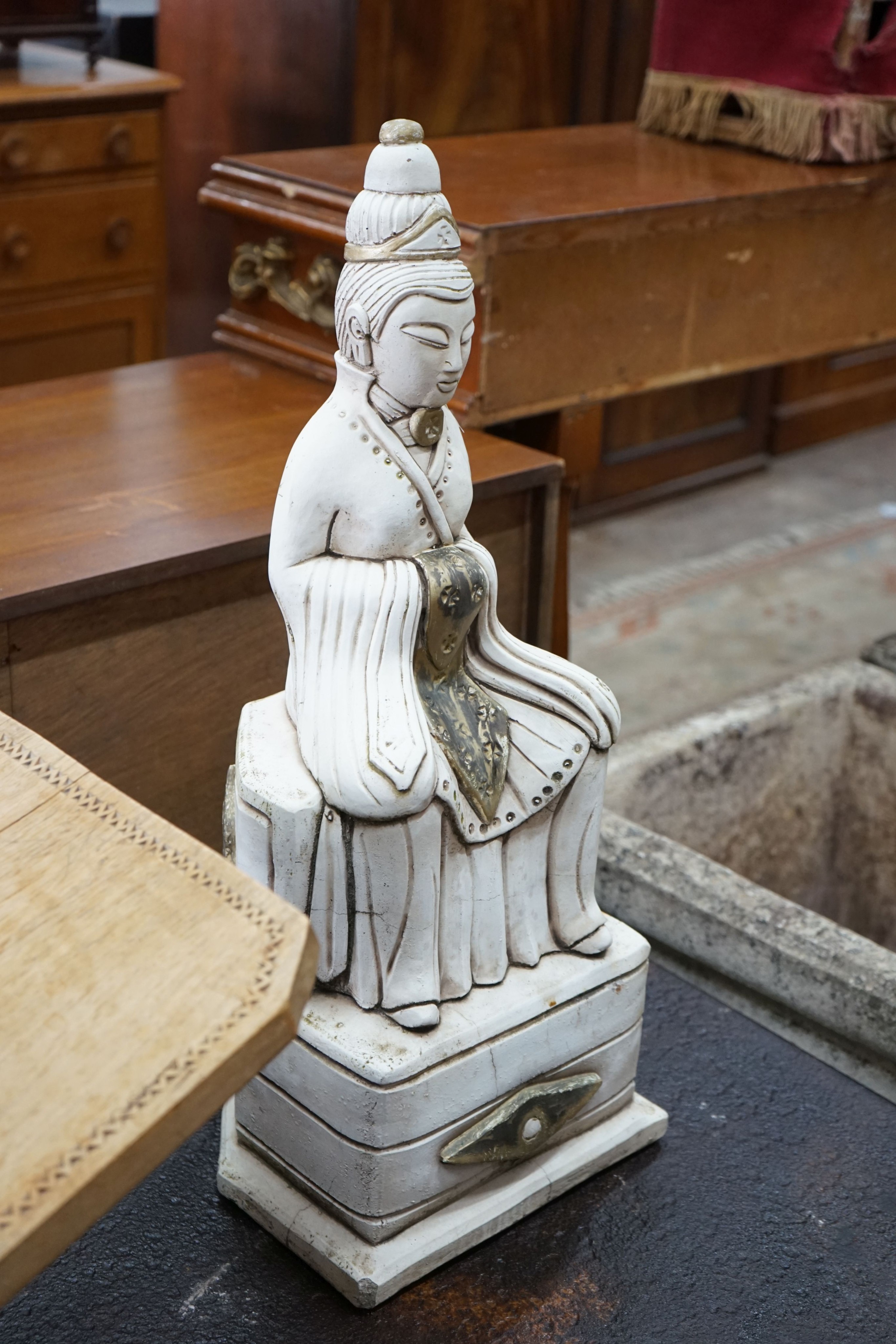A pair of stone seated Buddha garden ornaments, height 62cm